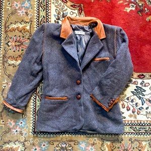 Vintage Escada blazer. 100% wool with leather detailing. Great condition.